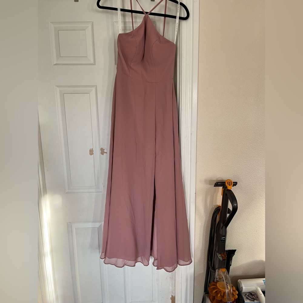 Light pink formal dress with a slit.
